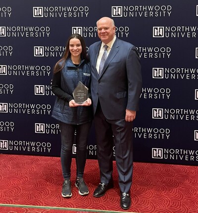 Cox Automotive CEO Steve Rowley (middle) presents Northwood University student Hayden Wilburn (left) the $10,000 Barbara Cox Scholarship Award.