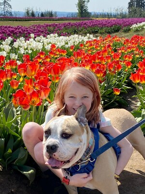 Brynn, pictured here with best friend Biggie, submitted her love story about how her adopted dog changes and impacts her life. Her winning Petco Love Story earns the organization she adopted Biggie from, Three Little Pitties, a $100,000 grant.