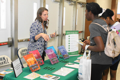 Pathways to LIFE Abroad International Education and Global Careers Fair held Saturday, May 20, 2023: Courtney Bauman from World Learning/School of International Training (SIT) speaks with Fair attendees. The Fair was sponsored by the L. Douglas Wilder School of Government and Public Affairs, Richmond Public Schools (RPS); the Commonwealth Virginia Chapter of The Links, Incorporated; City of Richmond Mayor's Youth Academy; Virginia Union University; and Policy Pathways, Inc.