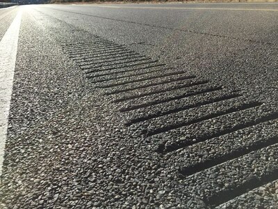 Carefully installed grooves in the roadway can create music when driven over.