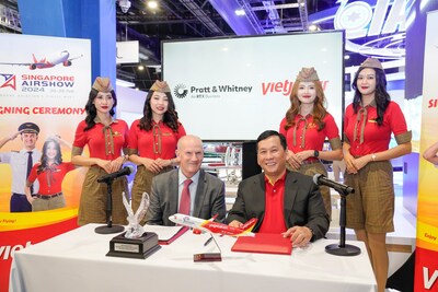 Rick Deurloo, president of Commercial Engines at Pratt & Whitney (left) and Dinh Viet Phuong, CEO, Vietjet (right) signing an agreement for RTX's Pratt & Whitney to provide GTF engines for 19 additional A321neo aircraft for Vietjet.