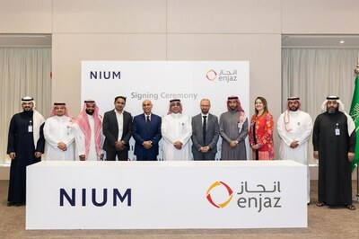 Nium and Enjaz executives at the signing ceremony.