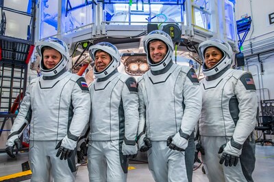 (Left to right) Roscosmos Cosmonaut Alexander Grebenkin and NASA Astronauts Michael Barratt, Matthew Dominick, and Jeanette Epps pose for a photo during their Crew Equipment Interface Test at NASA’s Kennedy Space Center in Florida. The goal of the training is to rehearse launch day activities and get a close look at the spacecraft that will take them to the International Space Station. Credit: SpaceX
