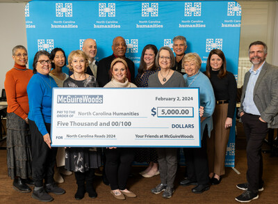 A group of NC Humanities Board Trustees receive McGuireWoods’ sponsorship of North Carolina Reads 2024 in Charlotte.
