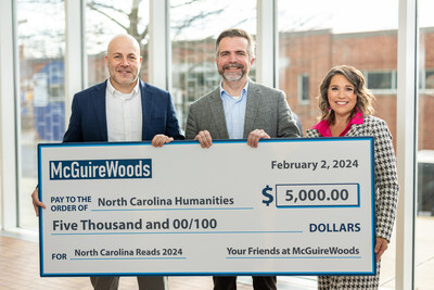 NC Humanities Vice Chair and McGuireWoods Charlotte Office Managing Partner, Brian Kahn presents McGuireWoods’ support of North Carolina Reads 2024 to NC Humanities Board Chair Mike Wakeford and NC Humanities Executive Director Sherry Paula Watkins.
