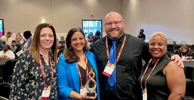 Pembroke Academy leaders pose for a photo after being awarded Central Michigan University's Innovation and Vision Award. From left: Middle School Dean Rachal Hetzel, Principal Salwa Kinsey, Upper Elementary Dean Kyle Worden, and Lower Elementary Dean Shena Hill-Scott.