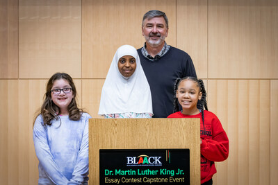 Jim Snee, chairman of the board, president and chief executive officer of Hormel Foods Corporation congratulated Yvanna Lopez, Aisha Mohamed and Madison Blair, Minneapolis for claiming top honors in the 13th annual Hormel Foods MLK essay contest.