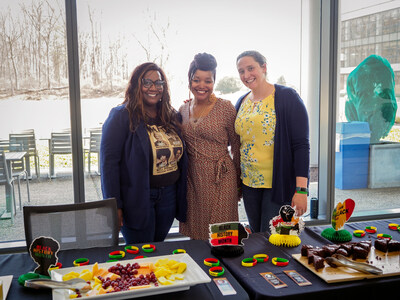 Olympus employees Christine Phatax, Tanisha Heard, and Sheena Guthrie, co-leads of the African American Employee Resource Group, host a Black History Month information table in the Olympus Corporation of the Americas' Center Valley headquarters.
