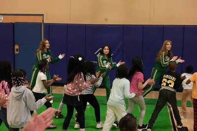 The Maine Celtics Hype Team leads a dance exercise for Sun Life Fit to Win at the Boys and Girls Club of Southern Maine.