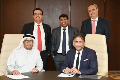From left to right, Abdul Raouf Al Mubarak, Chairman of Novelty Group and R Srikrishna, Chief Executive Officer & Executive Director of Hexaware Technologies are seen signing the JV agreement along with Amrinder Singh (in the left), Corporate Vice President & Head – EMEA & APAC Operations, Hexaware, Vikash Kumar Jain, Chief Financial Officer, Hexaware and Mehraz Parakh (in the right), Vice President - APAC SALES, Hexaware. (PRNewsfoto/Hexaware Technologies Ltd.)