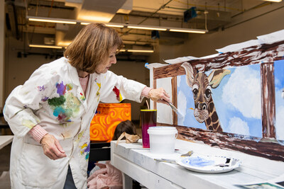 Artist Terry Cox-Joseph at work on her Sing for Hope Piano entitled 