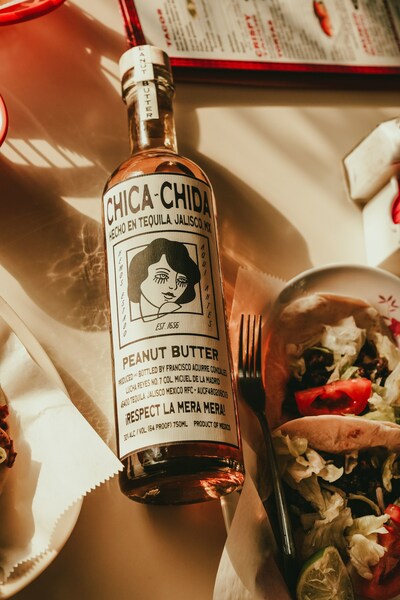 Piermont Brands proudly announces the launch of Chica~Chida Peanut Butter Agave Spirit, crafted in collusion with Caleb Pressley from Barstool Sports