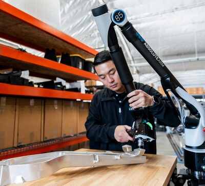 Aluminum part of an ARCH motorcycle is inspected with a Hexagon portable measuring arm