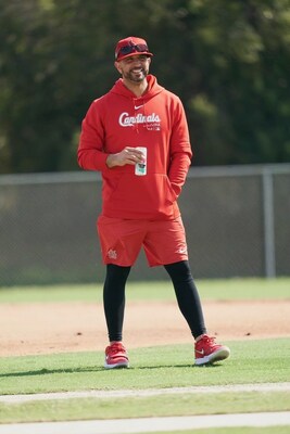Oliver Marmol, St. Louis Cardinals Manager, stays hydrated with Once Upon A Coconut on the practice field, embodying the spirit of health and excellence.