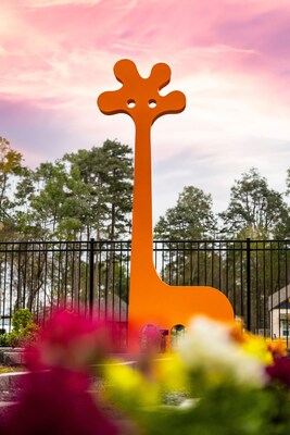 Orange Gigaffe sculpture by artist Jeffie Brewer at ARTAVIA