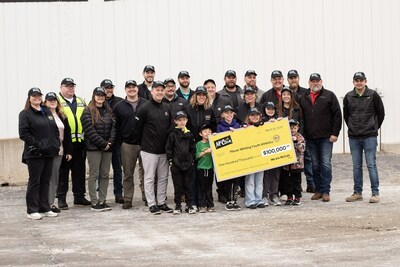 McCain Foods employees present $100,000 to Plover Whiting Youth Athletics for improvements to the Woyak Sports Complex in Plover, Wisconsin.