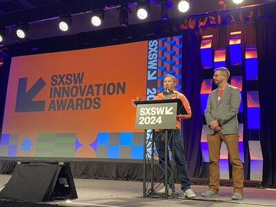Hunter McDaniel, CEO and Matt Bergren, CPO on stage to accept the SXSW 2024 Innovation Award. Photo credit to UbiQD, Inc.