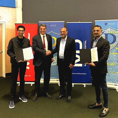 Official signing at Draper University, Silicon Valley. Pictured from left to right: Suffiyan Malik, Tim Draper from Draper University and Mahadhir Aziz, Raymond Siva From MDEC.