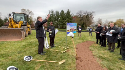 After praying over the future site of the Open-Air Mausoleum of the Holy Spirit, Cardinal Joseph Tobin, Cardinal Joseph W. Tobin, C.Ss.R., D.D., Archbishop of Newark, blesses the ground and cemetery staff members.
