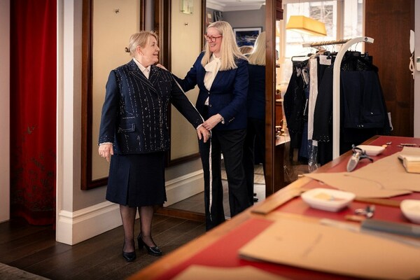 Captain Inger Thorhauge, who will be at the helm for Queen Anne’s maiden voyage, at a fitting with Kathryn Sargent  (Image at LateCruiseNews.com - March 2024)