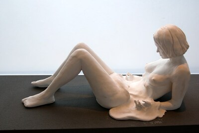 "Melt" by Ellen Wetmore. A sculpture of a woman's profile in a birthing position. Her abdomen appears melted, evoking a sense of fear and loss. Image courtesy of the artist.