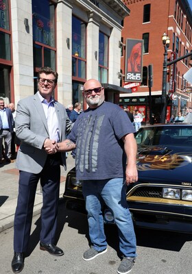 AMBEST President & CEO, Chuck Ryan & Stacey Hamilton pictured on Broadway, in front of Ole Red and the 2023 Grand Prize, 1978 Pontiac Firebird Trans Am.