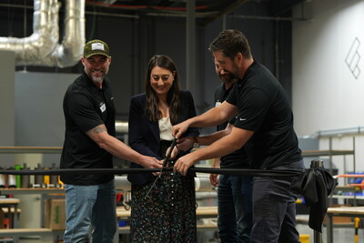 Congresswoman Sara Jacobs alongside Firestorm Founders cutting the ribbon at their new warehouse in San Diego, CA.