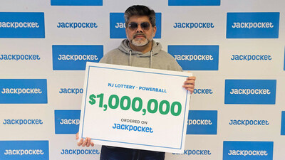 New Jersey Jackpocket winner holding $1,000,000 sign.