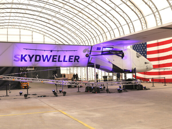 Skydweller aircraft in hangar during unveiling event.