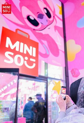 Customer taking photo of MINISO's Times Square