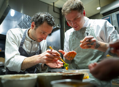 Chef John-Vincent Troiano of FRILU and Chef Joel Gray of Down Home collaborate on a dish featured at the inaugural A Taste of the Future dining event, presented by Mercedes-Benz in partnership with The MICHELIN Guide. The new dining series pairs chefs from Canadian MICHELIN-Starred restaurants with emerging Canadian culinary talent to create menus inspired by three key themes that are driving the future of automotive excellence at Mercedes-Benz: technology, aesthetics, and sustainability. (CNW Group/Mercedes-Benz Canada Inc.)