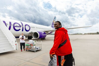 NC State Forward, DJ Burns, boards Avelo Airlines charter flight to Phoenix for the NCAA Final Four.