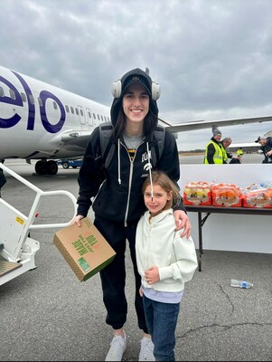 NCAA Division I all-time leading scorer, Caitlin Clark of Iowa women's basketball interacts with fans as she boards Avelo Airlines charter flight to NCAA Final Four in Cleveland.
