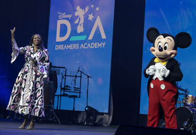 Disney Dreamers Academy Executive Champion Tracey Powell and Mickey Mouse take part in a moving commencement ceremony at Walt Disney World Resort in Lake Buena Vista, Fla. on April 7, 2024. (Mark Ashman, photographer)