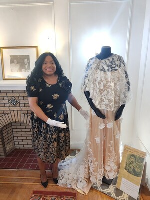 Jillian Patricia Pirtle, CEO of the Marian Anderson Museum & Historical Society, with a Marian Anderson performance gown damaged in the 2020 flood that also nearly destroyed the singer’s home.