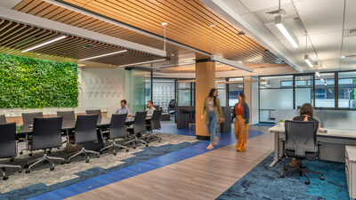 A vibrant workplace balancing functionality and style with open-plan seating and biophilic design.