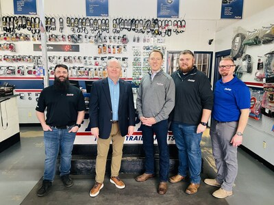 U.S. Representative Larry Bucshon of Indiana (second left) poses with FleetPride general counsel Baron Oursler (center) and other employees at a FleetPride location in Evansville, IN.