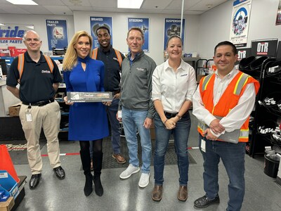 U.S. Representative Beth Van Duyne of Texas (second left) poses with FleetPride general counsel Baron Oursler (third from right) and other employees at a FleetPride location in Grapevine, TX.