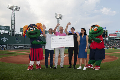 OOFOS execs, along with Dr. Tolaney, Chief of the Division of Breast Oncology at Dana-Farber Cancer Institute, present a check for $3.4million to Dana-Farber at a July 2023 Red Sox game.