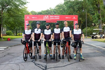 Team Duncan, including OOFOS leadership and staff and retired NFL QB Alex Smith, stand at the start of the 2023 Pan-Mass Challenge to raise money and honor the memory of OOFOS employee Duncan Finigan.