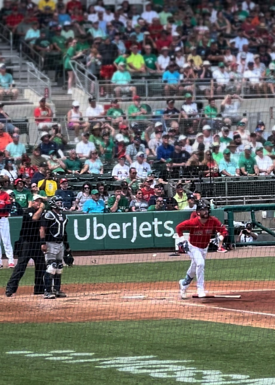 UberJets ads behind each team on-deck circle