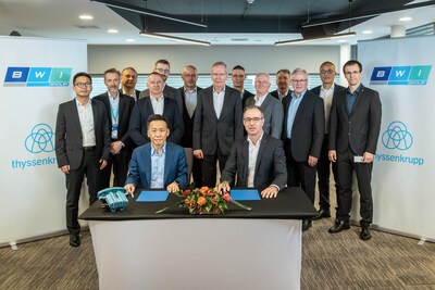 April 9, 2024, George Chang (Front Left), CEO of BWI Group, and Patrick Vith (Front Right), CEO of thyssenkrupp Steering, formalize the agreement in Budapest, Hungary. Executives from both companies present at the signing ceremony.