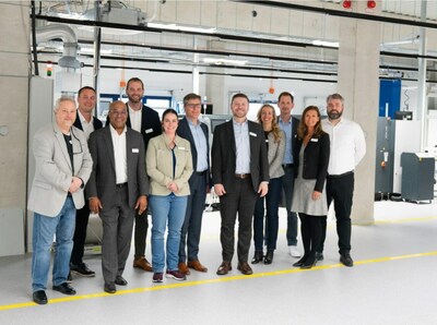 EA Elektro-Automatik and Tektronix executives in EA’s manufacturing facility in Germany