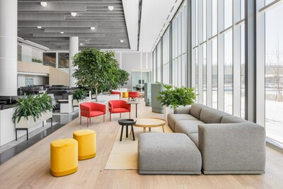 A casual meeting area along the raised podium of Targray's New World Headquarters Office Expansion