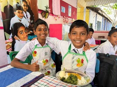 Grade 5 students in Colombo, Sri Lanka holding their morning meal, provided through the UN World Food Programme.  WFP/Carol Taylor
