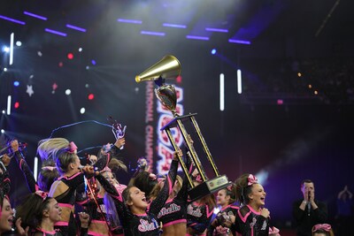The League by Varsity 2024 All Star League 6 Champions, East Celebrity Elite - Bombshells, lift championship trophy.