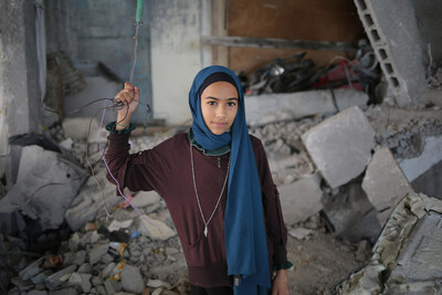 Sama, 12, stands inside her destroyed house in Rafah. “When the planes destroyed our house, me and my family were miraculously saved,” she says. “I want the war to stop now. I don't want to be displaced over and over; I only want to feel safe." Photo © UNICEF.