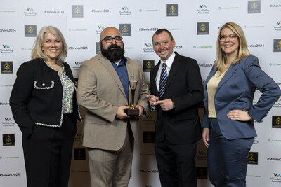 Michelle Birch, SVP of Operations at Bandwidth, accepts two Stevie Awards for Customer Service excellence along with team members Eddie Gonzalez, Matt Ruehlen and Kelli Doty (L to R).