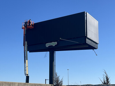 GreenSigns techs check connections upon completion of their sustainable billboard in the Chicago market. All of GreenSigns billboards run on 100% wind and solar en
