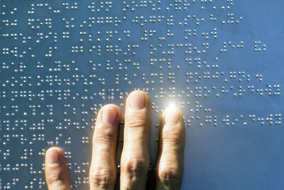 Old Dominion University, HaptX, and Georgia Institute of Technology have been awarded a U.S. NIH grant to investigate "Glove-based Tactile Streaming of Braille Characters and Digital Images for the Visually Impaired," using advanced HaptX Gloves for people to access embossed tactile writing systems in virtual environments. [Stock image from "Blindness Collection" via Getty Images.]